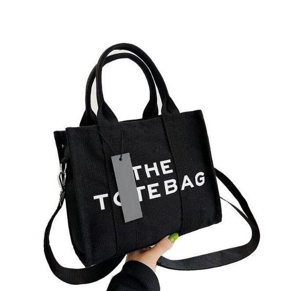 the tote bag marc canvas handbag women casual shoulder crossbody bag black purse famous designer tote bags jocobss fashion shopping bag, Black;red 
the tote bag marc canvas handbag women casual shoulder crossbody bag black purse famous designer tote bags jocobss fashion shopping bag, Black;red
