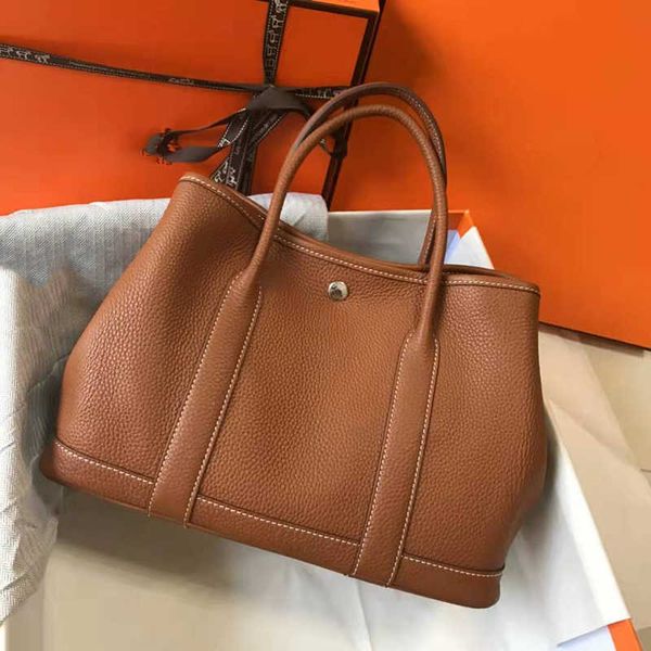 7a garden party bag women purse tote bucket bags handmade luxury designer handbags classic fashion togo leather canvas shopping retro instal
7a garden party bag women purse tote bucket bags handmade luxury designer handbags classic fashion togo leather canvas shopping retro instal