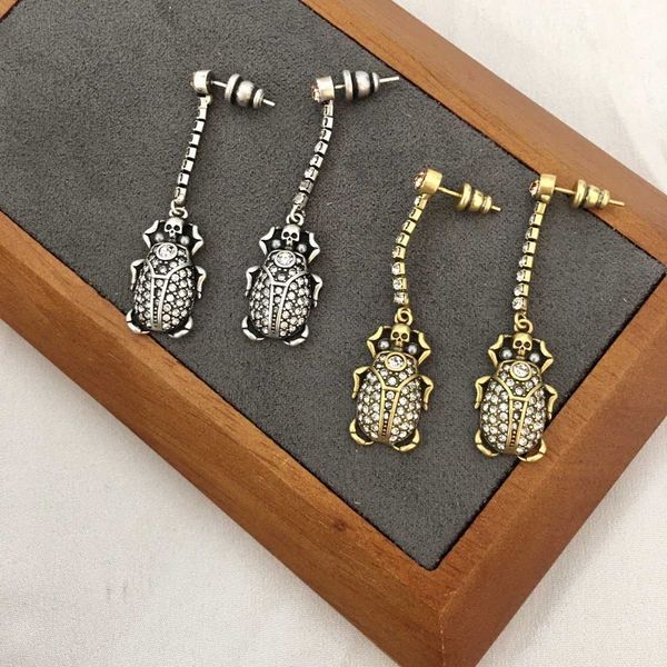 fashion designer alexander queen beetle full diamond skull long ear studs female personality super sparkling tassel pendant earrings, Golden
fashion designer alexander queen beetle full diamond skull long ear studs female personality super sparkling tassel pendant earrings, Golden