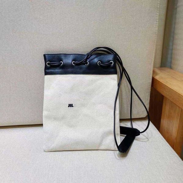jil minimalist brand's debut portable shoulder cowhide sail tote trendy niche canvas drawstring single portable bucket bag230821
jil minimalist brand's debut portable shoulder cowhide sail tote trendy niche canvas drawstring single portable bucket bag230821