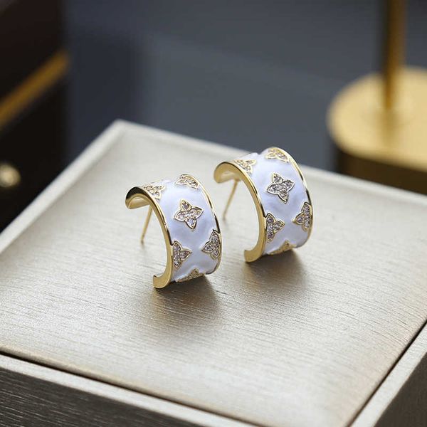 new light luxury style four leaf flower c-shaped zircon earrings with advanced design earrings for women 925 silver needle earrings, Golden
new light luxury style four leaf flower c-shaped zircon earrings with advanced design earrings for women 925 silver needle earrings, Golden