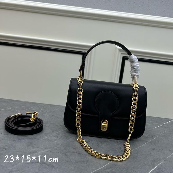 circular interlocking double handbag with black leather and gold adjustable accessories sheepskin lining with chain shoulder strap size 23x1
circular interlocking double handbag with black leather and gold adjustable accessories sheepskin lining with chain shoulder strap size 23x1