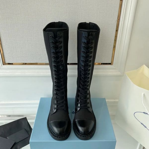 black calf leather trim patchwork nylon tall combat boots knee-high lace-up vamp rounded toe flat side logo triangle plaque luxury designer
black calf leather trim patchwork nylon tall combat boots knee-high lace-up vamp rounded toe flat side logo triangle plaque luxury designer