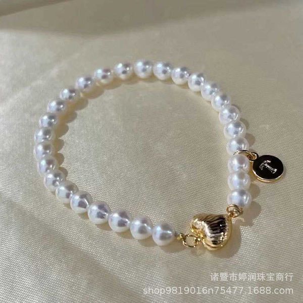 tiffay's same 14k gold wrapped love suction buckle 5.5-6mm freshwater pearl bracelet with nearly round and bright light bulb, Black
tiffay's same 14k gold wrapped love suction buckle 5.5-6mm freshwater pearl bracelet with nearly round and bright light bulb, Black