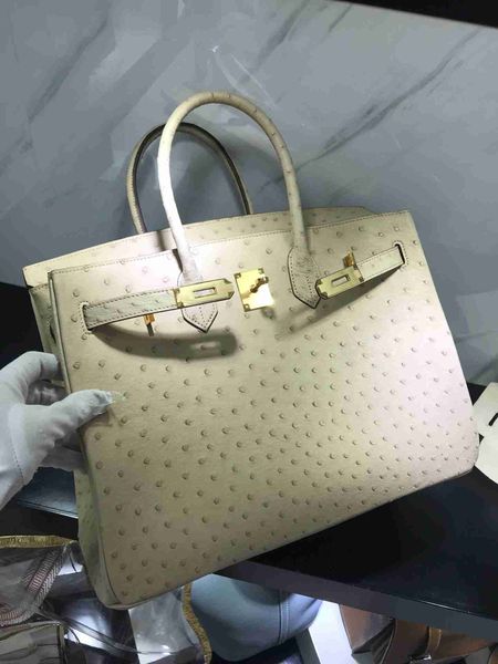 wholesale price fully handmade real ostrich skin design handbag30cm cream white brown color wax stitching gold and silver hardwarec
wholesale price fully handmade real ostrich skin design handbag30cm cream white brown color wax stitching gold and silver hardwarec