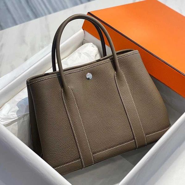 designer tote luxury lady garden party bag trendy calfskin taupe handbags women casual totes wallet
designer tote luxury lady garden party bag trendy calfskin taupe handbags women casual totes wallet