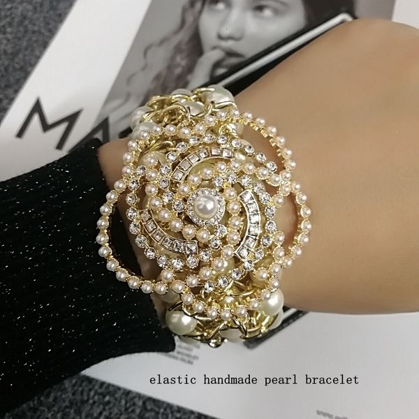 charm bracelets luxury handmade elastic pearl crystal camellia flower bangle jewelry for women 230301, Golden;silver
charm bracelets luxury handmade elastic pearl crystal camellia flower bangle jewelry for women 230301, Golden;silver