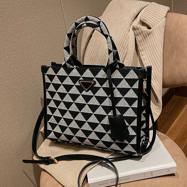 prade symbol embroidered fabric large tote bag shoulder bag geometric black and white color matching saffiano leather decoration totebag for
prade symbol embroidered fabric large tote bag shoulder bag geometric black and white color matching saffiano leather decoration totebag for