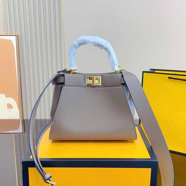 designer bag ladies mini kitten handbag button lock wide straps crossbody tote two compartments
designer bag ladies mini kitten handbag button lock wide straps crossbody tote two compartments