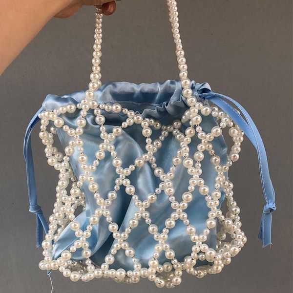 hand-held bucket type female worker weaves shrimp spring and summer multi-color three-dimensional hollowed-out imitation pearl bag women
hand-held bucket type female worker weaves shrimp spring and summer multi-color three-dimensional hollowed-out imitation pearl bag women