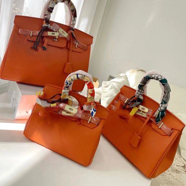 7a designer leather kellies gold large tote birkin bag cowhide 25cm 30cm with box tote woman shoulder bag handle hardware lady crossbody han
7a designer leather kellies gold large tote birkin bag cowhide 25cm 30cm with box tote woman shoulder bag handle hardware lady crossbody han