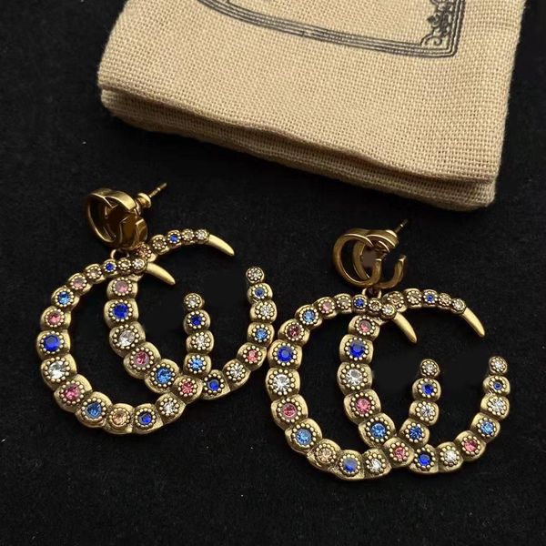 charm earring designers colored diamond stud double g letter brass material earrings for women wedding party jewelry with box, Golden
charm earring designers colored diamond stud double g letter brass material earrings for women wedding party jewelry with box, Golden