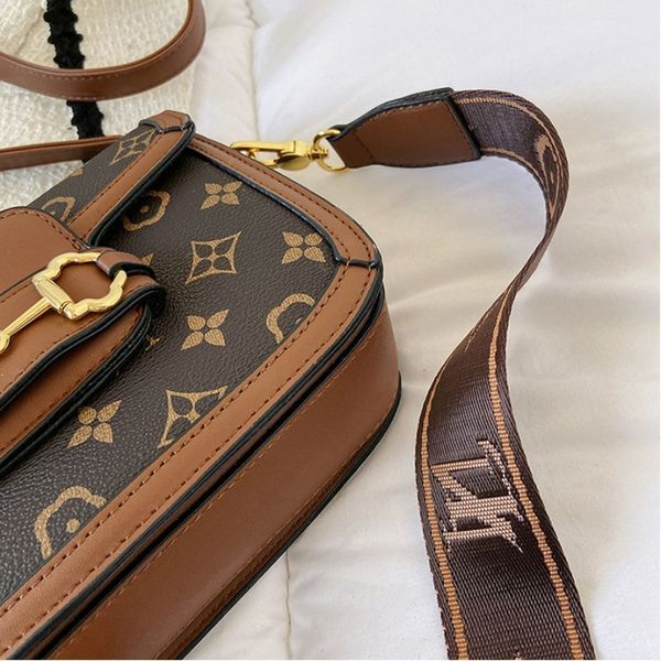 designer crossbody shoulder bag with adjustable and detachable of leather straps and fabric straps
designer crossbody shoulder bag with adjustable and detachable of leather straps and fabric straps