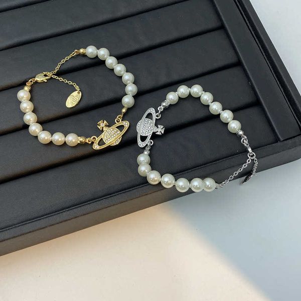 empress dowager xi's pearl female ins minority design sense of spring summer new and versatile temperament saturn pendant bracelet, Golden;silver
empress dowager xi's pearl female ins minority design sense of spring summer new and versatile temperament saturn pendant bracelet, Golden;silver