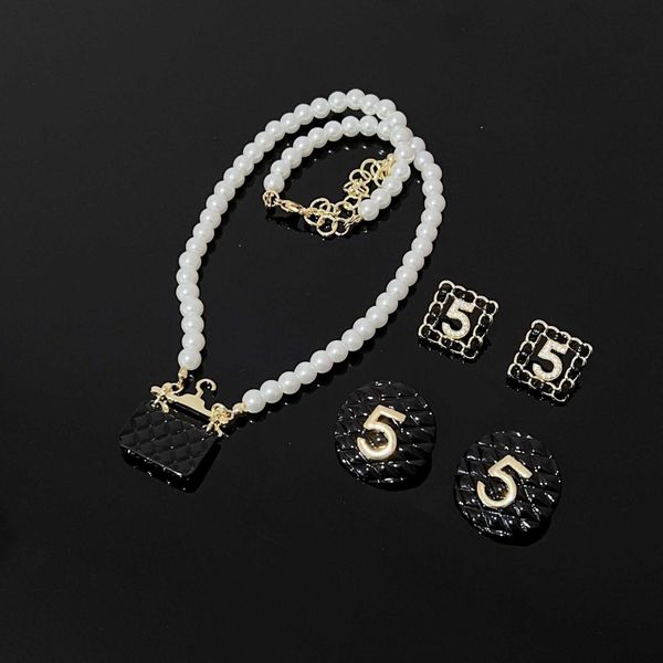 fan xiaoxiangfeng black bag pendant pearl necklace microinlaid with zircon digit 5 silver needle earrings female
fan xiaoxiangfeng black bag pendant pearl necklace microinlaid with zircon digit 5 silver needle earrings female