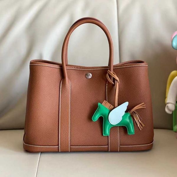 garden party bag handbag designer women 2023 bag family garden bag women's handmade wax line togo cow leather lychee leather tote qq
garden party bag handbag designer women 2023 bag family garden bag women's handmade wax line togo cow leather lychee leather tote qq