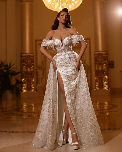 luxury mermaid wedding dresses sleeveless v neck off shoulder appliques sequins beaded feather train 3d lace side slit floor length lace bri, White
luxury mermaid wedding dresses sleeveless v neck off shoulder appliques sequins beaded feather train 3d lace side slit floor length lace bri, White