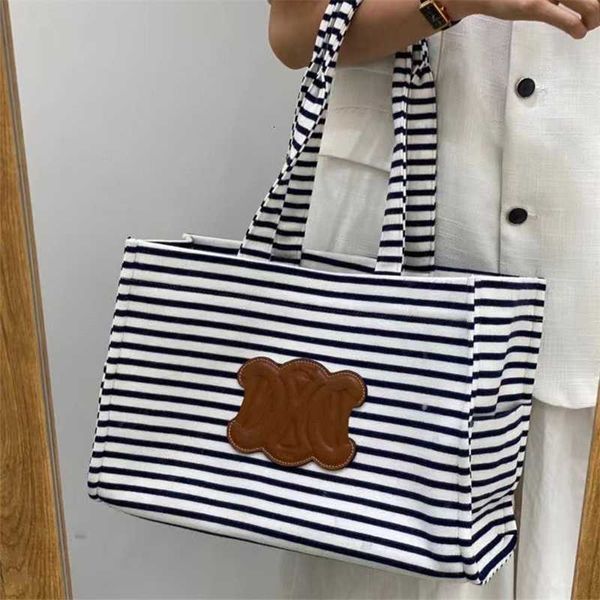2023 new arc de triomphe stripe canvas large capacity tot mommy shopping bag single shoulder portable women's
2023 new arc de triomphe stripe canvas large capacity tot mommy shopping bag single shoulder portable women's