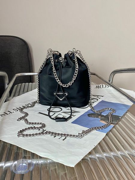 fashion women bucket shoulder bag nylon strapping opening large capacity chain designer triangle metal logo
fashion women bucket shoulder bag nylon strapping opening large capacity chain designer triangle metal logo