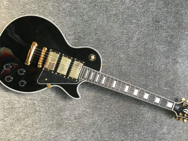 custom lp electric guitar mahogany body ebony fingerboard golden hardware 3 pickups black gloss finish
custom lp electric guitar mahogany body ebony fingerboard golden hardware 3 pickups black gloss finish