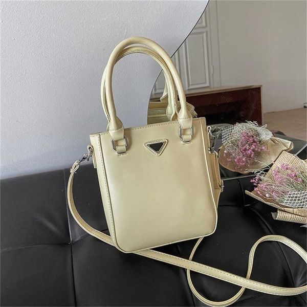 2023 designer bag handbag triangle standard net red same portable women's small summer single messenger
2023 designer bag handbag triangle standard net red same portable women's small summer single messenger
