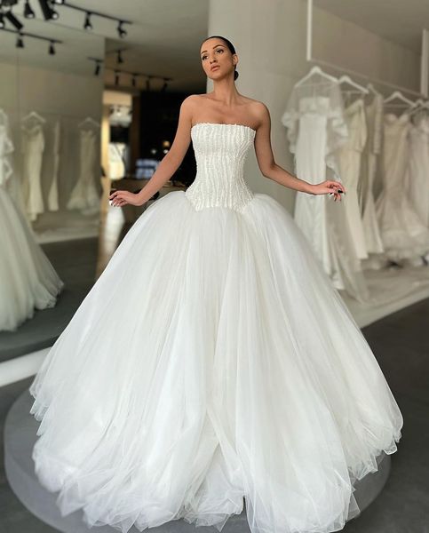 a line wedding dresses for bride strapless pearls beads tulle wedding dress vestidos de novia designer bridal gowns, White
a line wedding dresses for bride strapless pearls beads tulle wedding dress vestidos de novia designer bridal gowns, White
