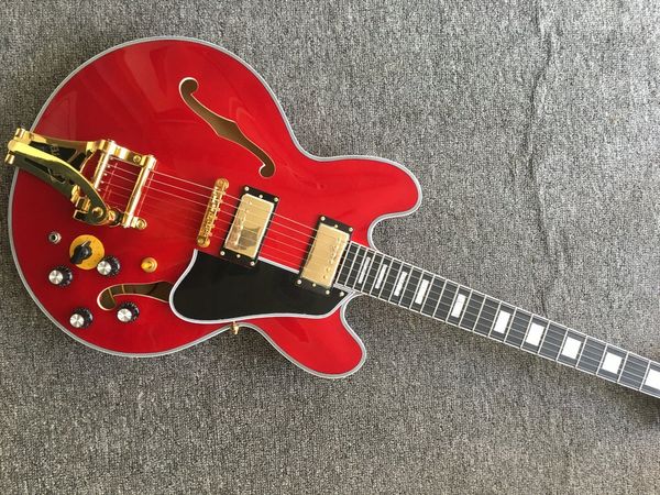 jazz guitar, red 335 body electric guitar, ebony fingerboard, vibrato system
jazz guitar, red 335 body electric guitar, ebony fingerboard, vibrato system