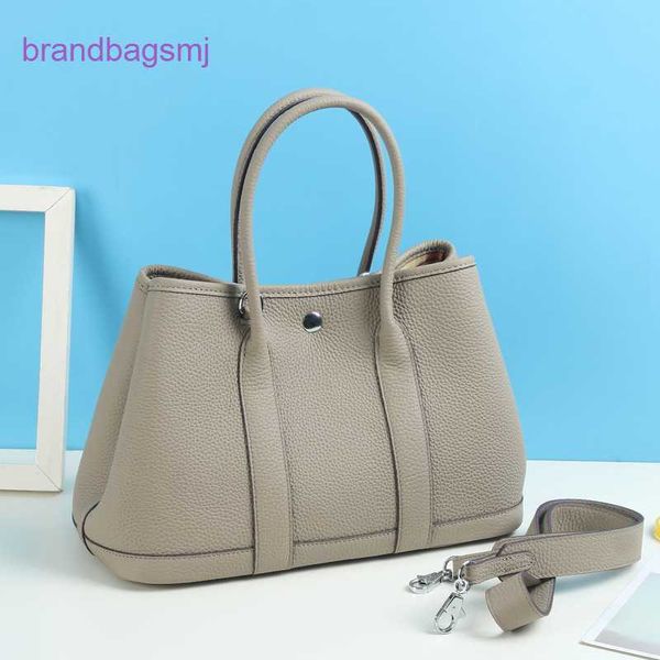 original designer handbags hermm litchi grain layer cowhide garden large capacity fashion tote leather lady hand wide shoulder strap
original designer handbags hermm litchi grain layer cowhide garden large capacity fashion tote leather lady hand wide shoulder strap