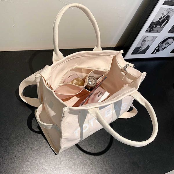 messenger hand-held canvas bag women's japanese and korean new one shoulder letter small square bag simple leisure large capacity fashi
messenger hand-held canvas bag women's japanese and korean new one shoulder letter small square bag simple leisure large capacity fashi