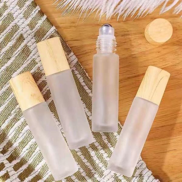 5ml 10ml frosted clear glass perfume roller bottle vials containers with metal roller ball and wood grain plastic cap
5ml 10ml frosted clear glass perfume roller bottle vials containers with metal roller ball and wood grain plastic cap