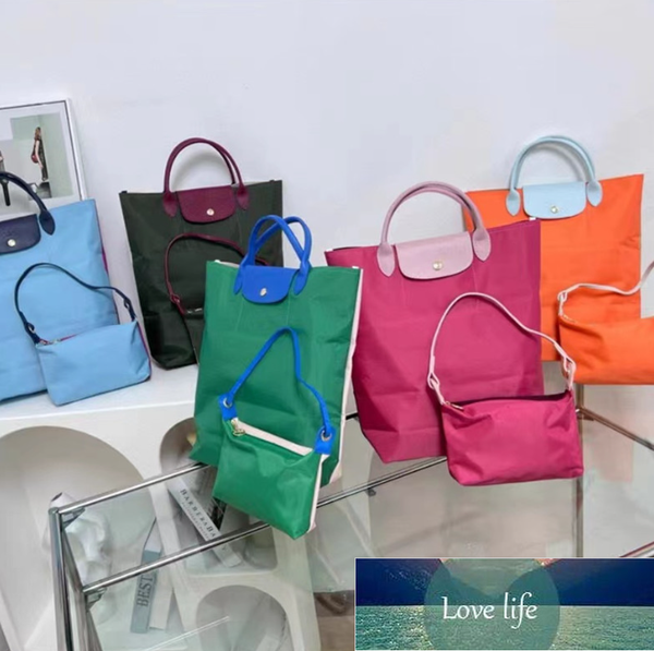 new color nylon portable tote bags female re-play three-color stitching vertical large capacity dumpling bag
new color nylon portable tote bags female re-play three-color stitching vertical large capacity dumpling bag