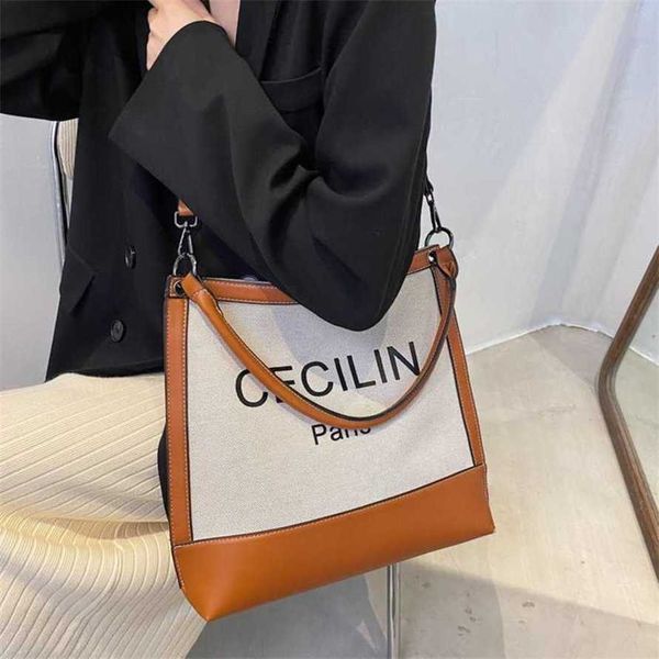15% off 2023 handbag tote women's autumn new canvas one shoulder underarm urban minimalist fashion letter hand carrying crossbody bag
15% off 2023 handbag tote women's autumn new canvas one shoulder underarm urban minimalist fashion letter hand carrying crossbody bag