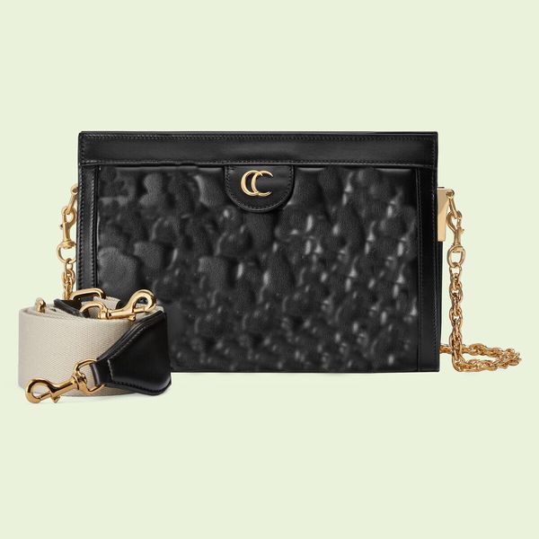 the medium shoulder bag is made of genuine leather material, with a gold chain embossed design and surface lining. classic style with interl
the medium shoulder bag is made of genuine leather material, with a gold chain embossed design and surface lining. classic style with interl