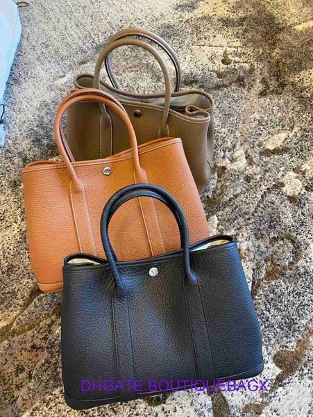 original edition designer hremm party garden bags online store new lychee grain cowhide garden bag large capacity tote real leather female p
original edition designer hremm party garden bags online store new lychee grain cowhide garden bag large capacity tote real leather female p
