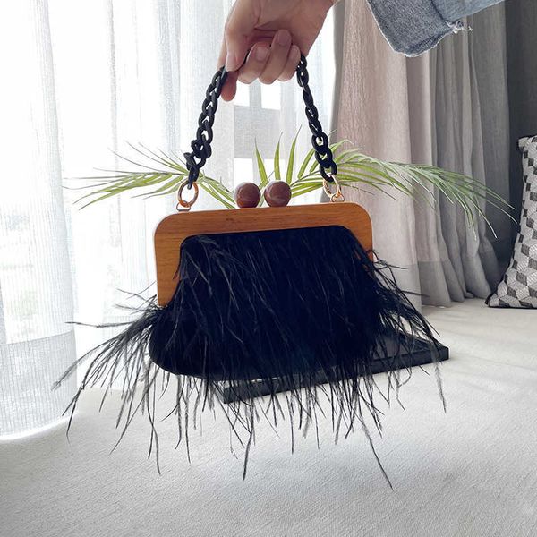 designer woman s wooden frame ostrich feather clutch bag faux fur acrylic chain bags tote handbag for woman luxury 230512
designer woman s wooden frame ostrich feather clutch bag faux fur acrylic chain bags tote handbag for woman luxury 230512