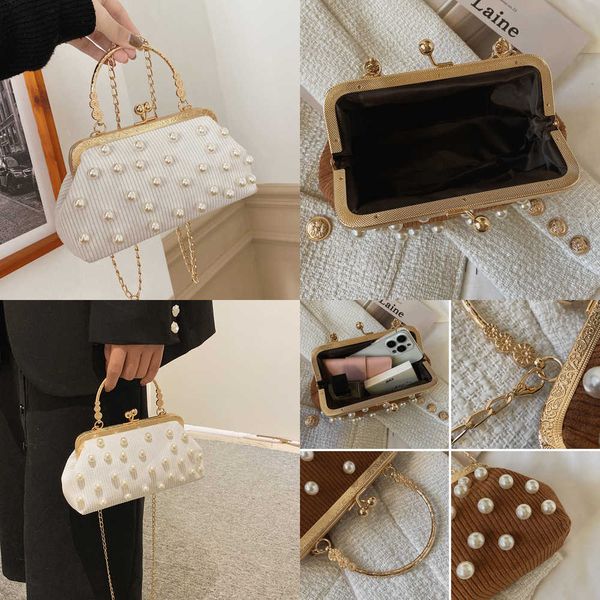 nxy luxury wedding party clutch bag pearled evening handbag female striped crossbody s for women metal frame clip shoulder 230424
nxy luxury wedding party clutch bag pearled evening handbag female striped crossbody s for women metal frame clip shoulder 230424