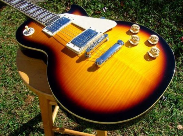 factory mahogany lp guitar vintage sunburst flame maple shadow nanomag pu electric guitar oem available258
factory mahogany lp guitar vintage sunburst flame maple shadow nanomag pu electric guitar oem available258