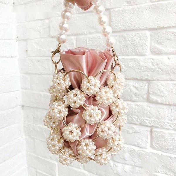shoulder bags hollow out pearl handbgs women new luxury small beaded clutch purses and handbags ladies woven bag wedding party 230426
shoulder bags hollow out pearl handbgs women new luxury small beaded clutch purses and handbags ladies woven bag wedding party 230426