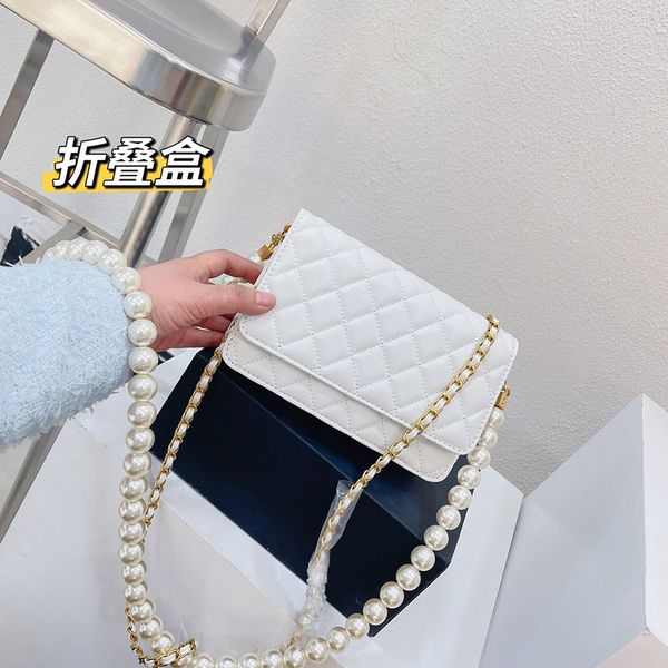 2023 designer bag evening crossbody women's shoulder pearl chain bags luxury brand woc plain simple small square bag lambskin mobile ph
2023 designer bag evening crossbody women's shoulder pearl chain bags luxury brand woc plain simple small square bag lambskin mobile ph