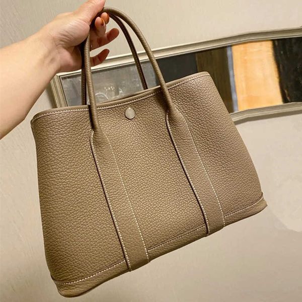 no box new togo genuine leather women's bag one shoulder tote bag versatile garden bag portable big bag shopping bag bucket bag
no box new togo genuine leather women's bag one shoulder tote bag versatile garden bag portable big bag shopping bag bucket bag
