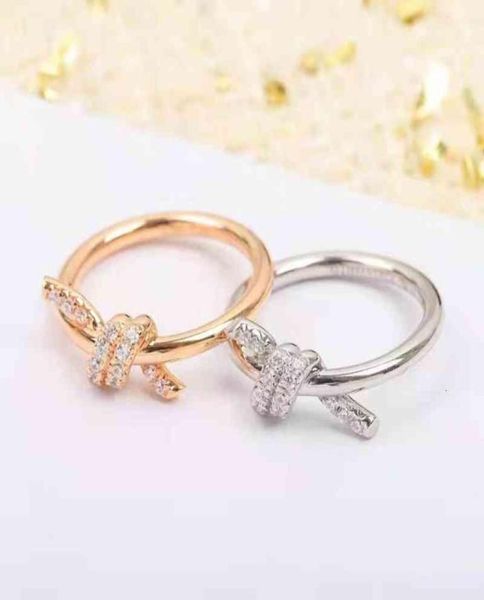 t039s new fashion knot series double line ring with cross and kink design diamond inlaid couple039s6454321, Silver
t039s new fashion knot series double line ring with cross and kink design diamond inlaid couple039s6454321, Silver