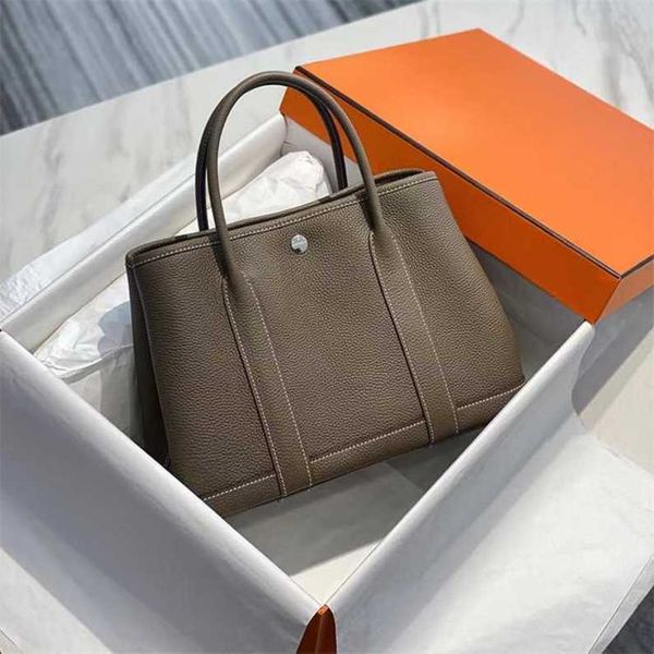 authentic handbag original garden party tote bag handmade wax thread togo cowhide commuting big woman
authentic handbag original garden party tote bag handmade wax thread togo cowhide commuting big woman