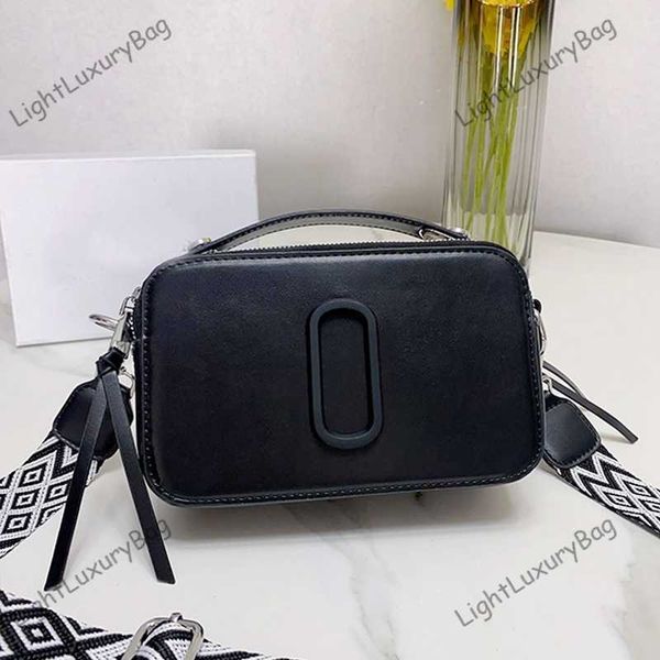 2023 new the snapssmall camera style bag designer bags dual closure crossbody women removable adjustable webbing strap black purses 230518
2023 new the snapssmall camera style bag designer bags dual closure crossbody women removable adjustable webbing strap black purses 230518