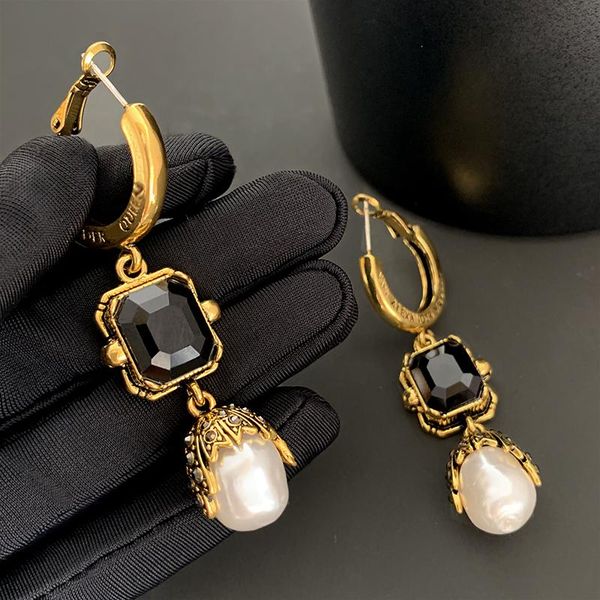 huggie european and american exaggerated long black pearl earrings female personality retro earrings, Golden;silver
huggie european and american exaggerated long black pearl earrings female personality retro earrings, Golden;silver