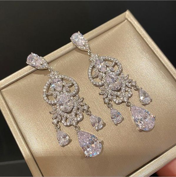 knot ladies temperament hollow pattern water drop pendant earrings full of zircon bridal wedding luxury earrings, Silver
knot ladies temperament hollow pattern water drop pendant earrings full of zircon bridal wedding luxury earrings, Silver