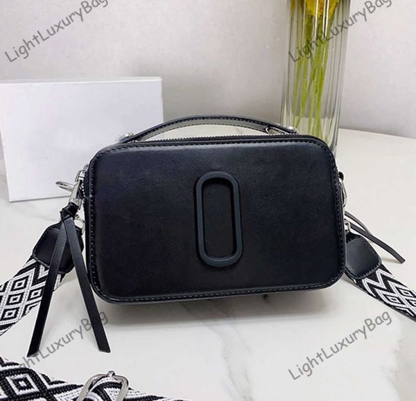 new brand snapssmall camera style bag designer bags dual closure crossbody women removable adjustable webbing strap black purses 230518
new brand snapssmall camera style bag designer bags dual closure crossbody women removable adjustable webbing strap black purses 230518