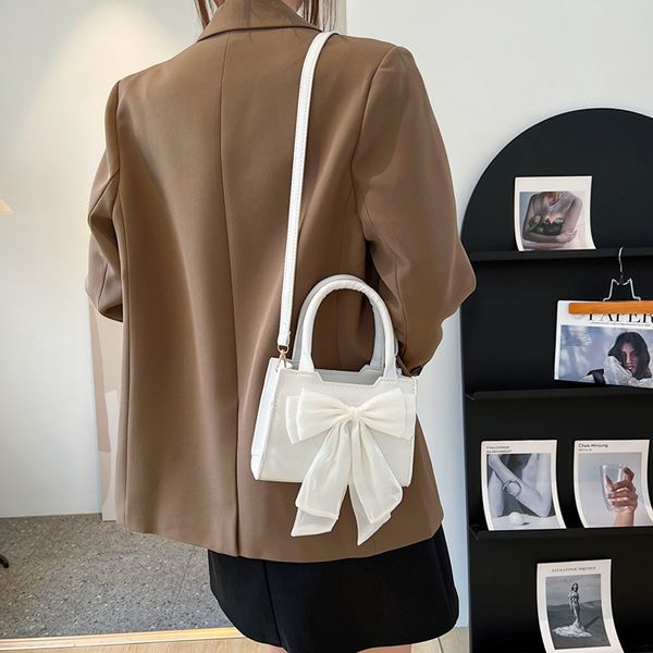 waist bags white bowknot womens portable shoulder bag big bow design ladies underarm solid color pu leather female small tote handbag 230520
waist bags white bowknot womens portable shoulder bag big bow design ladies underarm solid color pu leather female small tote handbag 230520