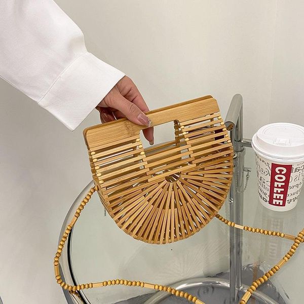 hollow woven handbag summer fashion messenger bag bamboo semi-circular portable beach bag 230524
hollow woven handbag summer fashion messenger bag bamboo semi-circular portable beach bag 230524