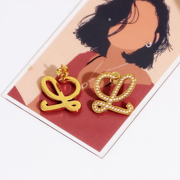 stud fashion geometric letters inlaid pearl earrings female european and american hollow plated 18k gold earrings wedding accessories, Golden;silver
stud fashion geometric letters inlaid pearl earrings female european and american hollow plated 18k gold earrings wedding accessories, Golden;silver