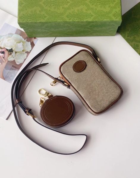 women men designer crossbody bags 22ss phone bag two pieces with round leather headphone case 700959 women fashion mini purses
women men designer crossbody bags 22ss phone bag two pieces with round leather headphone case 700959 women fashion mini purses